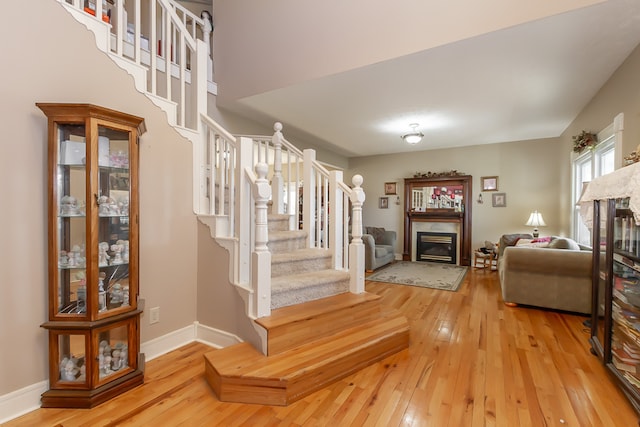 stairway featuring hardwood / wood-style flooring