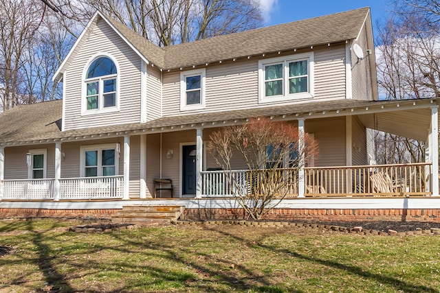 view of front of home featuring a front yard and covered porch