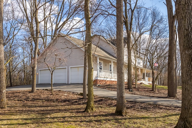 view of front of home with a garage and a porch