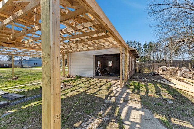 garage featuring a lawn