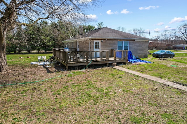 back of house with a yard and a deck