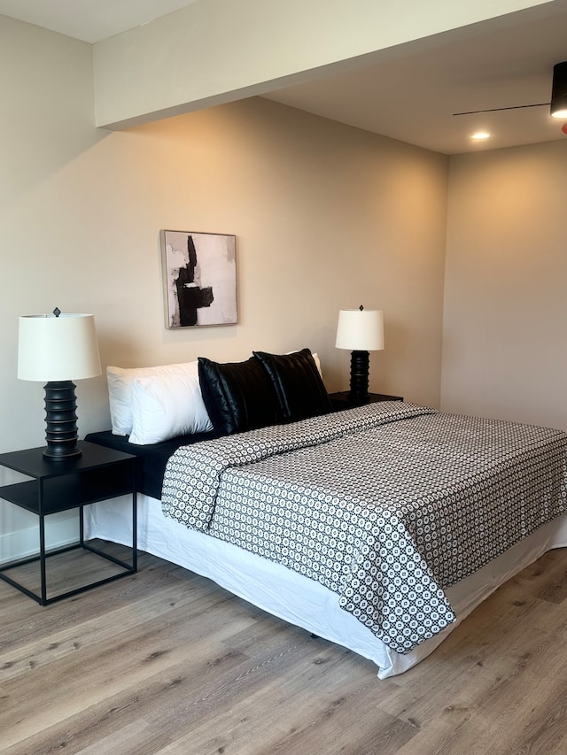 bedroom with hardwood / wood-style floors