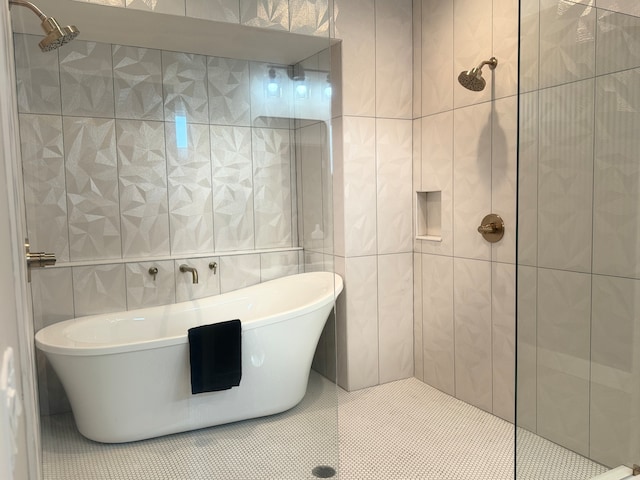 bathroom with tile walls and a tile shower