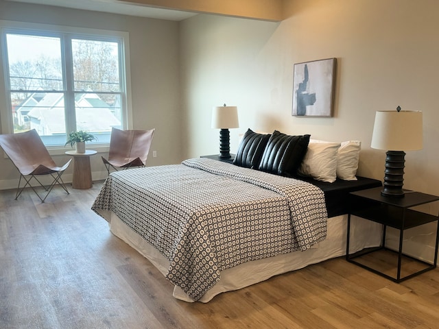 bedroom with light hardwood / wood-style floors