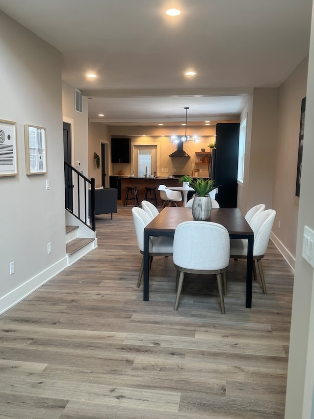 dining area with wood-type flooring