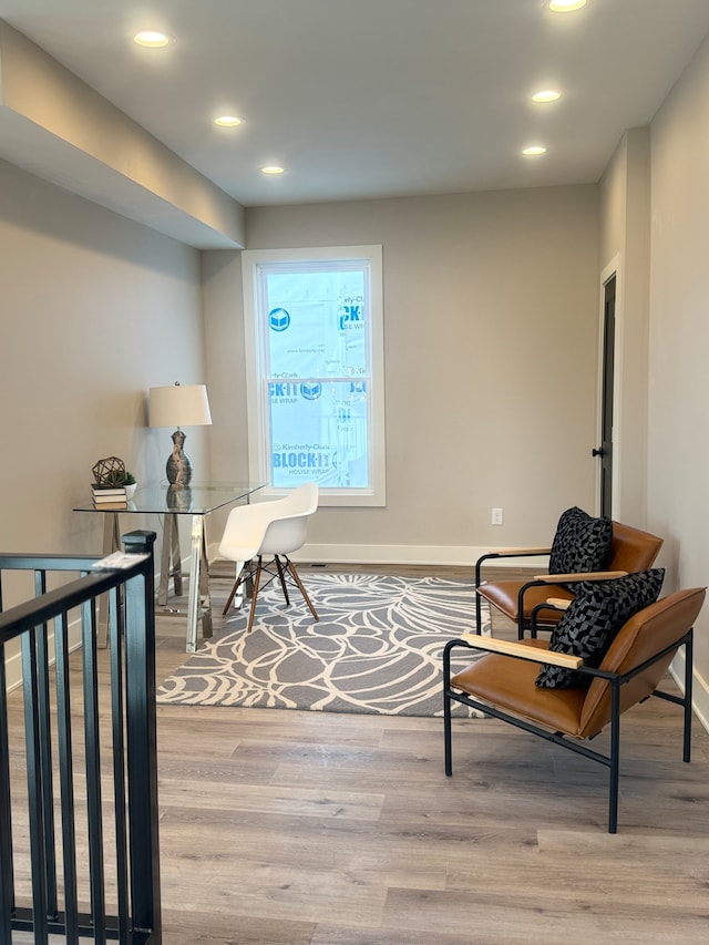 sitting room featuring light hardwood / wood-style flooring