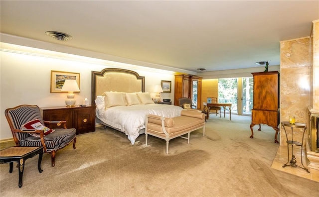 carpeted bedroom with french doors