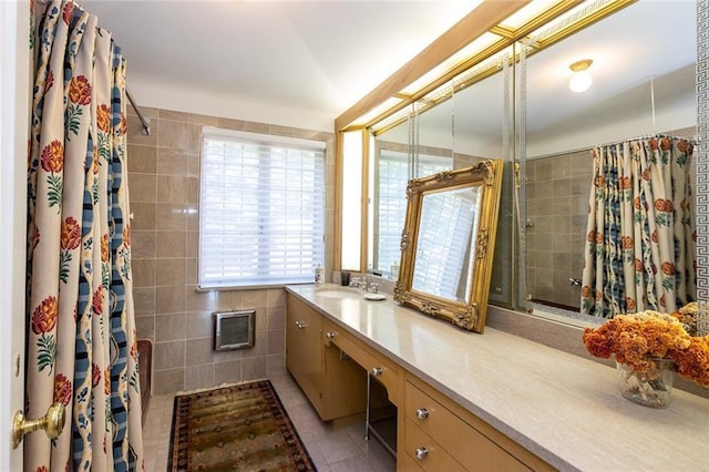 bathroom featuring tile walls, tile floors, and vanity