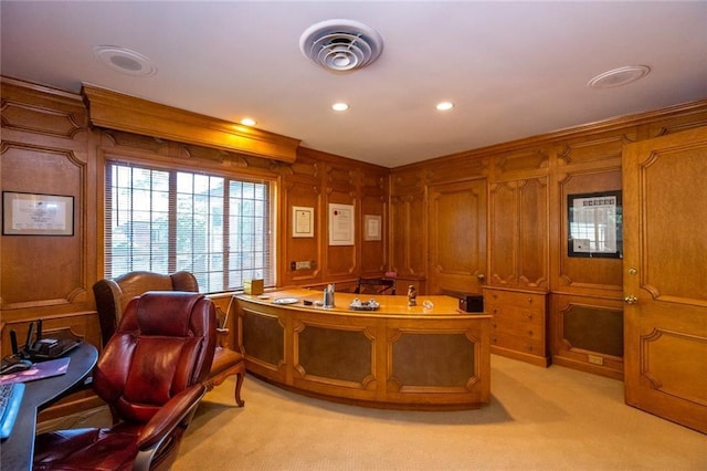 office area featuring wood walls and light colored carpet