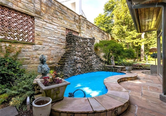 view of swimming pool featuring a patio