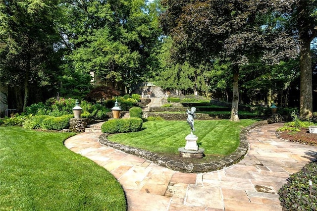 surrounding community featuring a yard and a patio area