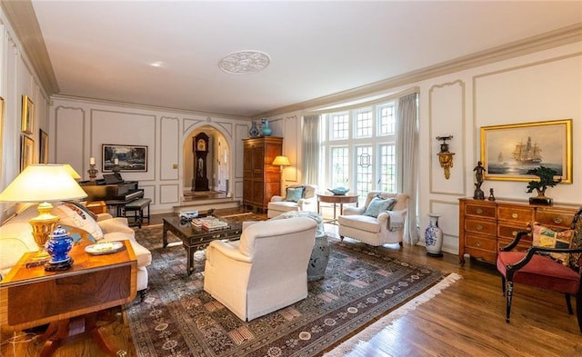 living room with dark hardwood / wood-style floors and ornamental molding