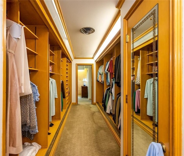 spacious closet featuring light carpet