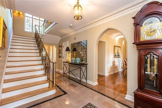 interior space with ornamental molding and light wood-type flooring