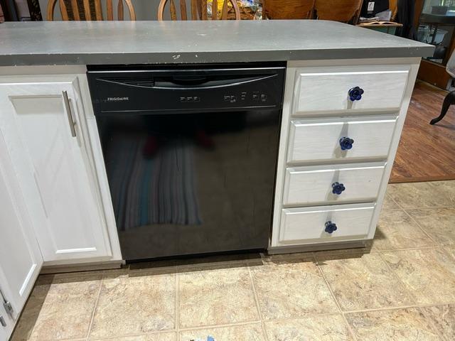 details featuring dishwasher and white cabinets