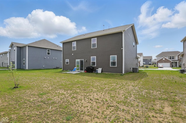 back of property featuring cooling unit, a lawn, and a patio
