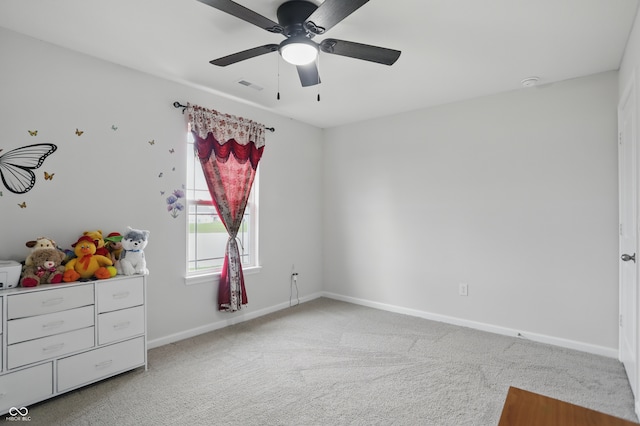 unfurnished bedroom with light carpet, baseboards, and ceiling fan