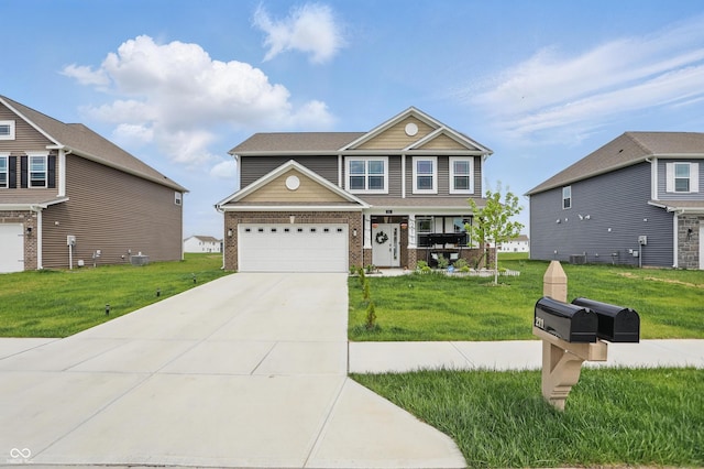 craftsman-style house featuring brick siding, a front yard, and driveway