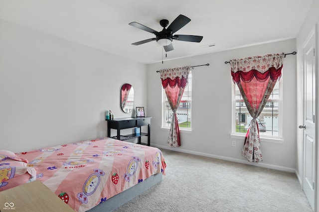 bedroom featuring carpet flooring, baseboards, and ceiling fan