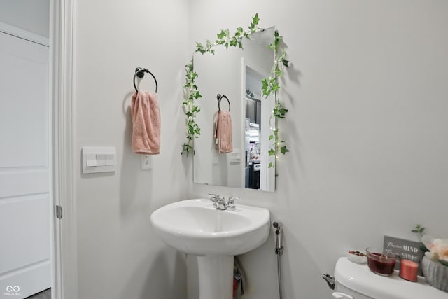 bathroom featuring toilet
