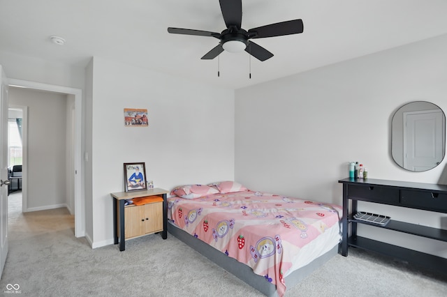 bedroom with carpet, baseboards, and a ceiling fan