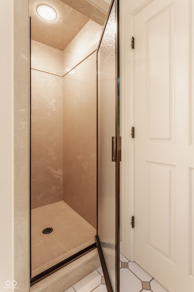 bathroom with tiled shower