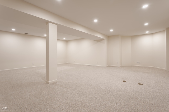 basement with light colored carpet