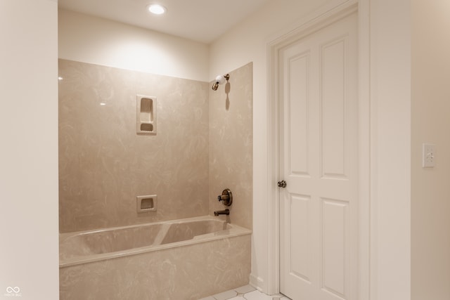 bathroom featuring tile patterned floors and tiled shower / bath combo