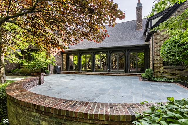 rear view of house featuring a patio