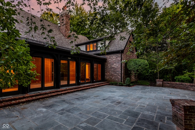 view of patio terrace at dusk