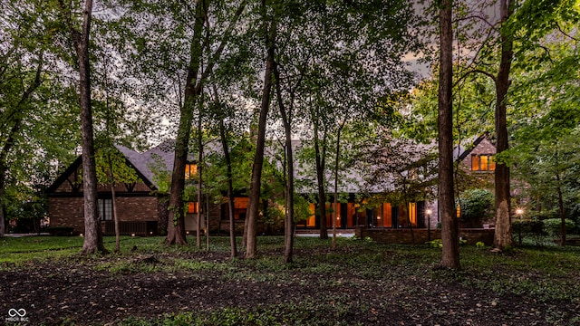 view of back house at dusk