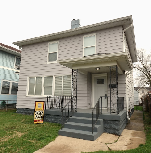 view of front of property with a front lawn