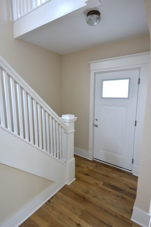 entryway with dark hardwood / wood-style floors