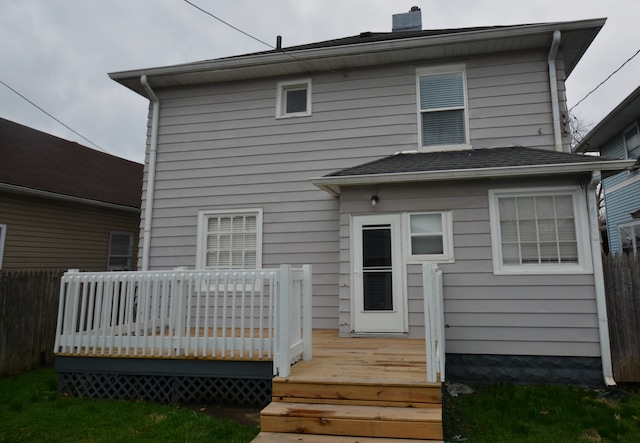 back of property featuring a wooden deck