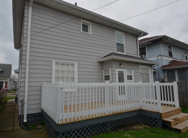 rear view of house featuring a deck