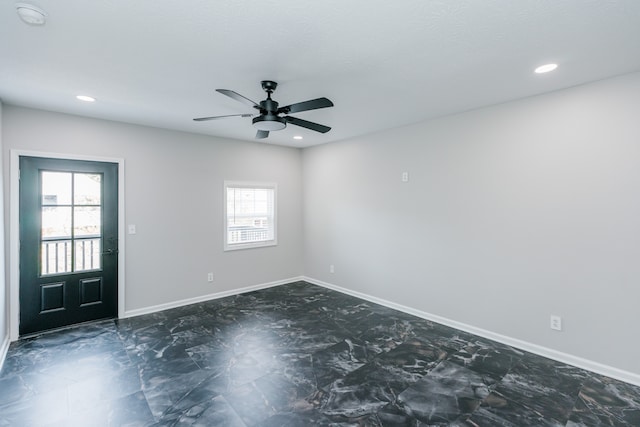 unfurnished room with ceiling fan