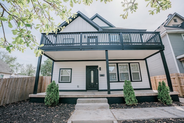 view of front facade featuring covered porch and a balcony