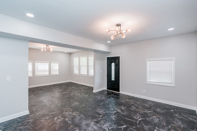 foyer with a notable chandelier