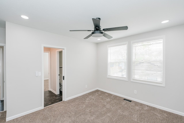 spare room featuring carpet floors and ceiling fan