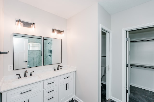 bathroom with an enclosed shower and vanity