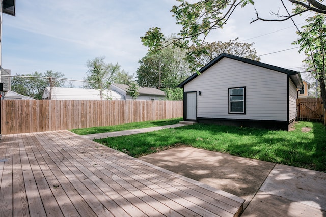 wooden terrace with a yard and a patio area