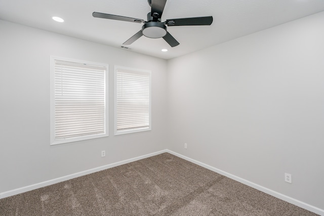 empty room featuring ceiling fan and carpet flooring