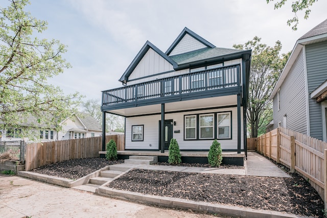 view of front of home featuring covered porch and a balcony