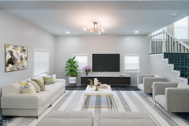 living room with a notable chandelier