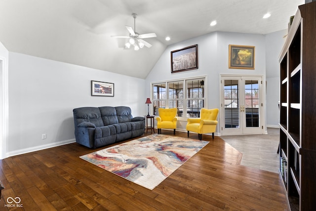 living room with dark hardwood / wood-style flooring, high vaulted ceiling, french doors, and ceiling fan