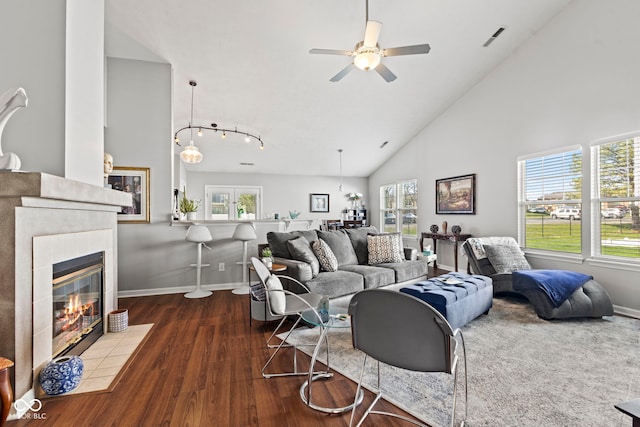 5220 Ariana Ct, Indianapolis, IN 46227 - living room featuring wood finished floors, ceiling fan, high vaulted ceiling, and a fireplace