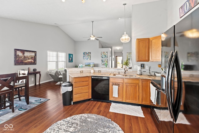 5220 Ariana Ct, Indianapolis, IN 46227 - kitchen with black appliances, a peninsula, dark wood-style flooring, a ceiling fan, and high vaulted ceiling