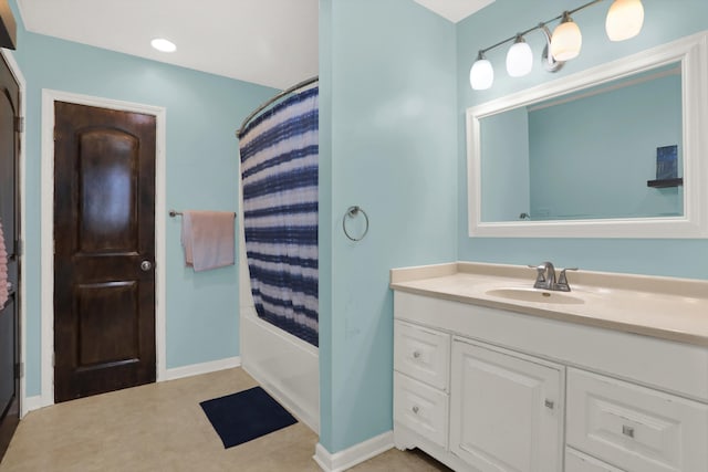 bathroom featuring tile flooring, large vanity, and tub / shower combination