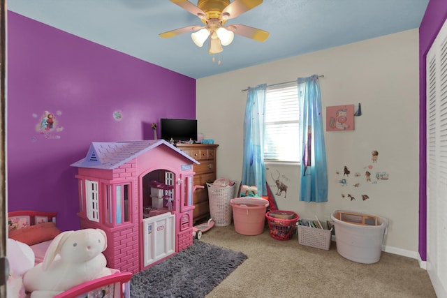 rec room featuring light colored carpet and ceiling fan