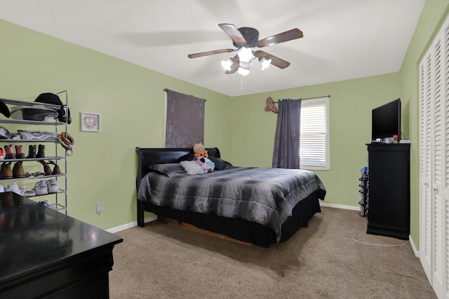 bedroom featuring a closet, ceiling fan, and light colored carpet